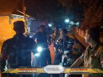 Sinergi TNI dan Masyarakat Jaga Keamanan Desa Menang Raya Lewat Patroli Siskamling Malam